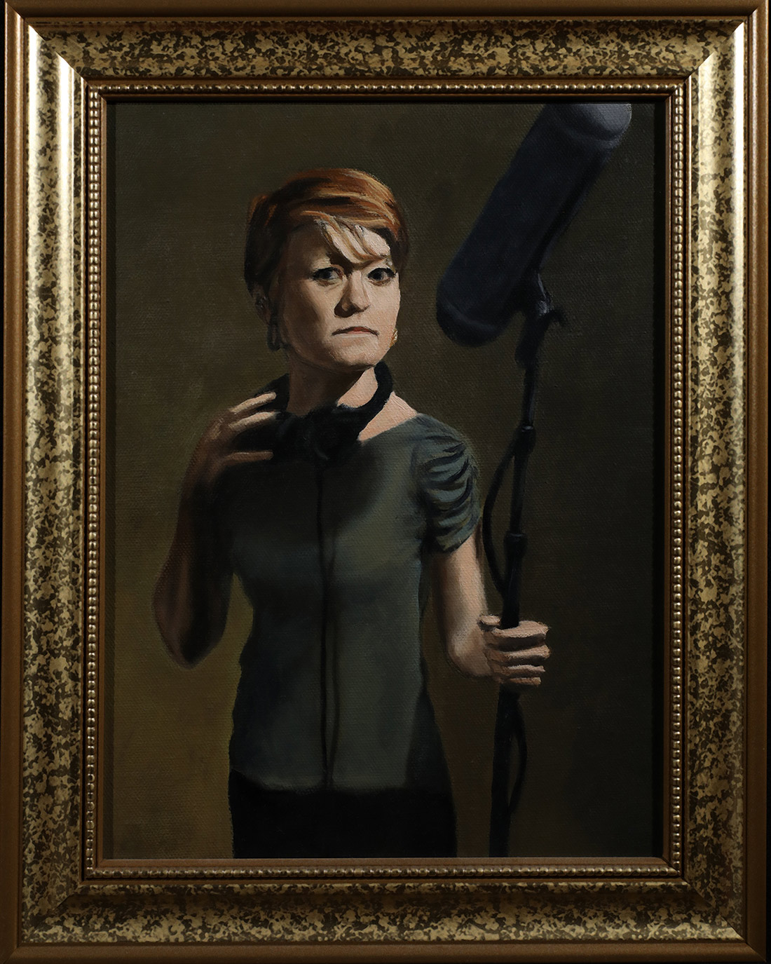Alice with a boom mic and headphones.