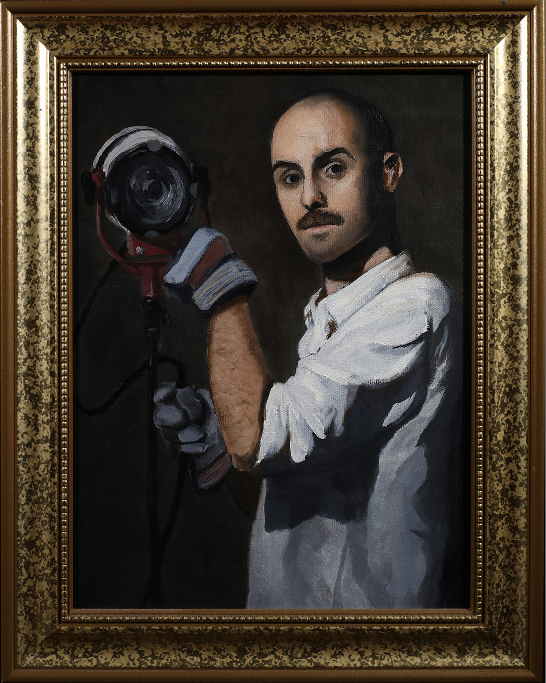 Ferran adjusting a Tweenie lamp with gloves on.